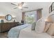 Comfortable bedroom with white shiplap wall, ceiling fan, hardwood floors, and stylish furnishings at 1326 Sea Elder Dr, Kiawah Island, SC 29455