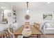 Bright dining area showcasing a wooden table, stylish décor, and seamless flow into the cozy living space at 1326 Sea Elder Dr, Kiawah Island, SC 29455