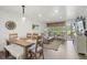 Open concept dining area with wood table, comfortable seating, and scenic views overlooking a golf course at 1326 Sea Elder Dr, Kiawah Island, SC 29455