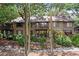 Multi-story townhouse with charming balconies surrounded by lush greenery and mature trees at 1326 Sea Elder Dr, Kiawah Island, SC 29455
