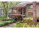 A charming townhouse exterior showcases a stairway and lush greenery at 1326 Sea Elder Dr, Kiawah Island, SC 29455