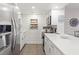 Modern kitchen featuring stainless steel appliances, white cabinets, quartz countertops, and hardwood floors at 1326 Sea Elder Dr, Kiawah Island, SC 29455
