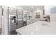 Modern kitchen featuring stainless steel appliances, white cabinets, quartz countertops, and breakfast bar at 1326 Sea Elder Dr, Kiawah Island, SC 29455