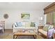 Inviting living area featuring a comfortable sofa, stylish decor, and seamless flow into the adjacent dining space at 1326 Sea Elder Dr, Kiawah Island, SC 29455