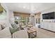 Inviting living room provides views of the golf course with comfortable seating and natural light at 1326 Sea Elder Dr, Kiawah Island, SC 29455