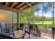 Screened porch with seating provides ample space with beautiful golf course views at 1326 Sea Elder Dr, Kiawah Island, SC 29455