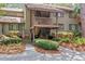 Inviting two-story condo with exterior stairs and lush landscaping for a serene and private feel at 1326 Sea Elder Dr, Kiawah Island, SC 29455