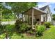 Home's backyard featuring mature trees and outdoor living space at 1431 Whispering Oak Trl, Mount Pleasant, SC 29466