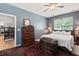 Cozy bedroom with a large window, a comfortable bed, and a beautiful antique chest for storage at 1431 Whispering Oak Trl, Mount Pleasant, SC 29466