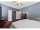 Well-lit bedroom with an en-suite bathroom and easy access to the staircase, offering convenience and privacy at 1431 Whispering Oak Trl, Mount Pleasant, SC 29466