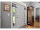 Bright entryway featuring hardwood floors and an antique cabinet at 1431 Whispering Oak Trl, Mount Pleasant, SC 29466