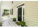 Charming front porch with decorative plants, offering a cozy entrance to the home at 1431 Whispering Oak Trl, Mount Pleasant, SC 29466