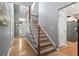 Spacious hallway with hardwood floors leading to the staircase and other rooms at 1431 Whispering Oak Trl, Mount Pleasant, SC 29466