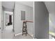 Upstairs hallway featuring neutral paint, plush carpet, and natural light at 1431 Whispering Oak Trl, Mount Pleasant, SC 29466