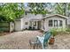 Spacious backyard with a gravel area, seating, and lush landscaping at 1433 Oaklanding Rd, Mount Pleasant, SC 29464