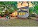 Charming backyard featuring a sunroom and cozy outdoor seating area at 1433 Oaklanding Rd, Mount Pleasant, SC 29464