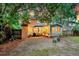 Relaxing backyard featuring a sunroom and cozy outdoor seating area at 1433 Oaklanding Rd, Mount Pleasant, SC 29464