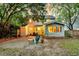 Inviting backyard featuring a sunroom and cozy outdoor seating area at 1433 Oaklanding Rd, Mount Pleasant, SC 29464