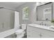Well-lit bathroom with a shower, toilet, and modern vanity with a marble countertop at 1433 Oaklanding Rd, Mount Pleasant, SC 29464