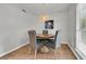 Cozy dining area with a round table, stylish chairs, and a decorative pendant light at 1433 Oaklanding Rd, Mount Pleasant, SC 29464