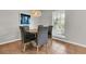 Bright dining area with a round table, seating for four, and natural light from the window at 1433 Oaklanding Rd, Mount Pleasant, SC 29464