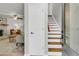 Inviting entryway featuring hardwood stairs, interior door and partial view of the living room at 1433 Oaklanding Rd, Mount Pleasant, SC 29464