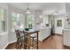 Open kitchen with white cabinets, quartz countertops, hardwood floors, and modern stainless steel appliances at 1433 Oaklanding Rd, Mount Pleasant, SC 29464
