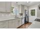 Bright kitchen featuring quartz countertops, stainless steel appliances, and a view to the backyard at 1433 Oaklanding Rd, Mount Pleasant, SC 29464