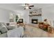 Spacious living room featuring a brick fireplace, neutral walls, and comfortable seating at 1433 Oaklanding Rd, Mount Pleasant, SC 29464