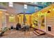 Inviting patio with string lights, outdoor seating, and a grill, perfect for entertaining guests and relaxing at 1433 Oaklanding Rd, Mount Pleasant, SC 29464