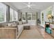 Bright sun room featuring tile floors, lots of windows, and comfortable seating for relaxation at 1433 Oaklanding Rd, Mount Pleasant, SC 29464
