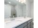 Elegant bathroom with double sink vanity, gray cabinetry, and a large mirror at 153 Royal Cainhoy Way, Huger, SC 29450