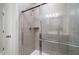 Modern tiled shower featuring a glass door and a built-in shower niche at 153 Royal Cainhoy Way, Huger, SC 29450