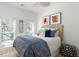 Inviting bedroom with a cozy bed, stylish headboard, ample natural light, and chic coastal decor at 1532 Sea Palms Cres, Mount Pleasant, SC 29464
