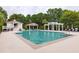 Inviting community pool with a gazebo, a pool house, and comfortable lounge chairs at 1532 Sea Palms Cres, Mount Pleasant, SC 29464