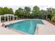Expansive community pool surrounded by trees and lounge chairs for relaxation at 1532 Sea Palms Cres, Mount Pleasant, SC 29464