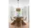 Cozy dining room with natural light, stylish light fixture, and seating for six at 1532 Sea Palms Cres, Mount Pleasant, SC 29464