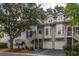 Charming townhome featuring double front porches, white trim, and garage parking at 1532 Sea Palms Cres, Mount Pleasant, SC 29464