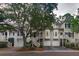 Charming townhouses with well-maintained lawns, garages, and inviting staircases at 1532 Sea Palms Cres, Mount Pleasant, SC 29464