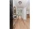 Welcoming foyer with wood floors, shiplap walls, and views into the connected living spaces at 1532 Sea Palms Cres, Mount Pleasant, SC 29464