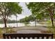Peaceful pond view with a fountain, framed by lush trees and seen from a bench at 1532 Sea Palms Cres, Mount Pleasant, SC 29464