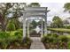 Scenic pond view with a fountain, swing bench, and well-maintained landscaping at 1532 Sea Palms Cres, Mount Pleasant, SC 29464
