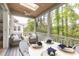 Relaxing screened porch with comfortable seating, dining table, and scenic outdoor views at 1532 Sea Palms Cres, Mount Pleasant, SC 29464