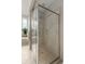 Modern tiled shower with glass doors, rain shower head, and built-in niche at 1532 Sea Palms Cres, Mount Pleasant, SC 29464