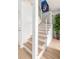 Beautiful stairway with wood treads, white risers, and modern stainless steel railings at 1532 Sea Palms Cres, Mount Pleasant, SC 29464