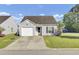 Charming one-story home with a one-car garage and well-kept lawn in a suburban neighborhood at 157 Tyger St, Summerville, SC 29485