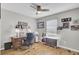This home office is lit by a ceiling fan and a window for great lighting at 157 Tyger St, Summerville, SC 29485