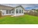 Home's backyard with green lawn and privacy fence, offering outdoor space for relaxation and entertainment at 159 Townsend Way, Summerville, SC 29483