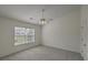 Bright bedroom featuring a ceiling fan and a large window overlooking the lawn at 159 Townsend Way, Summerville, SC 29483