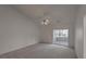 Large primary bedroom with vaulted ceilings, plush carpeting, and access to a sunroom at 159 Townsend Way, Summerville, SC 29483